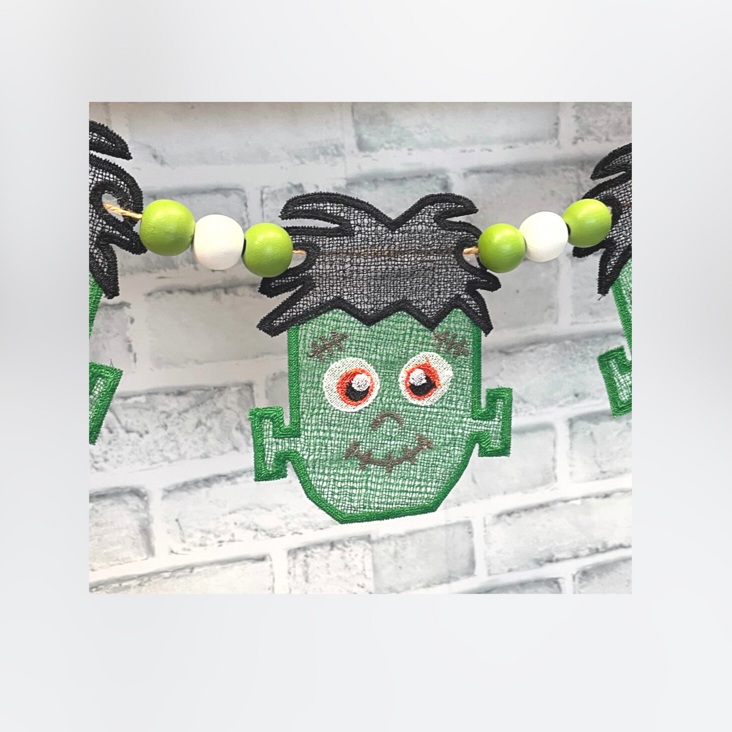 Lace machine embroidery design of Frankentien's head
