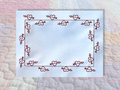 Heart and Arrows quilt label border in the hoop embroidery design