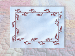 Heart and Arrows quilt label border in the hoop embroidery design