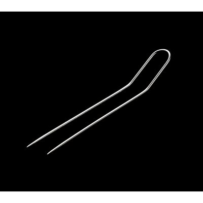photo of a single fork pin, on a black background